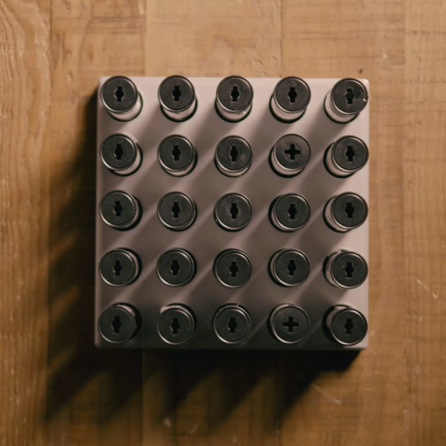 A tray of 35mm film canisters seen from above